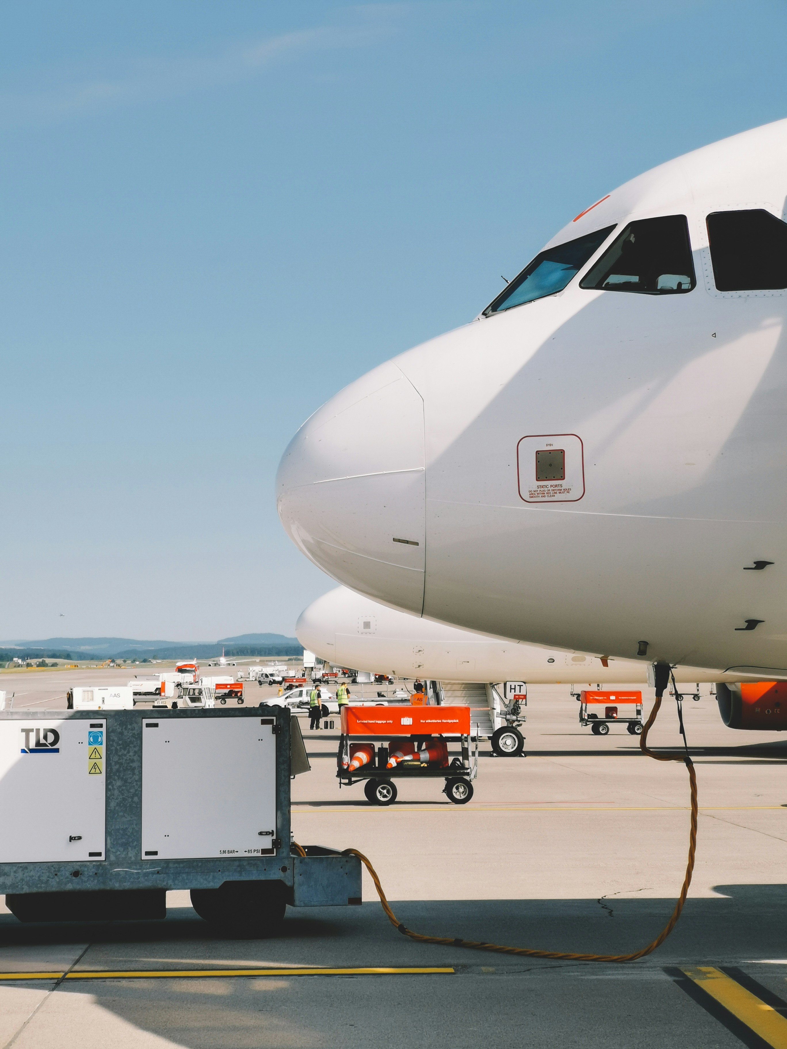 White aircraft under clear blue sky